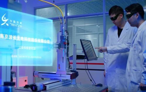 Engineers performing laser system construction and simulation testing